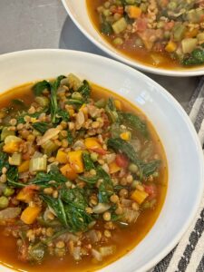 white bowl full of vegetable lentil soup