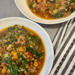 white bowl full of vegetable lentil soup